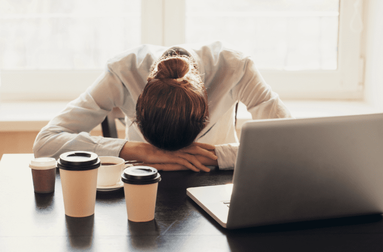woman taking a nap in the table